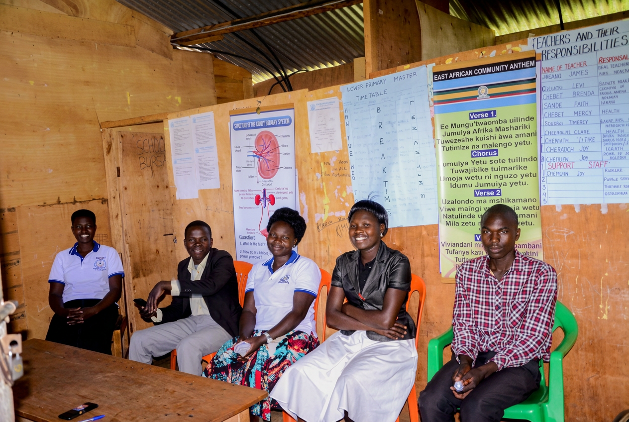 Staff and students of Vision of Joy School gathered inside a classroom